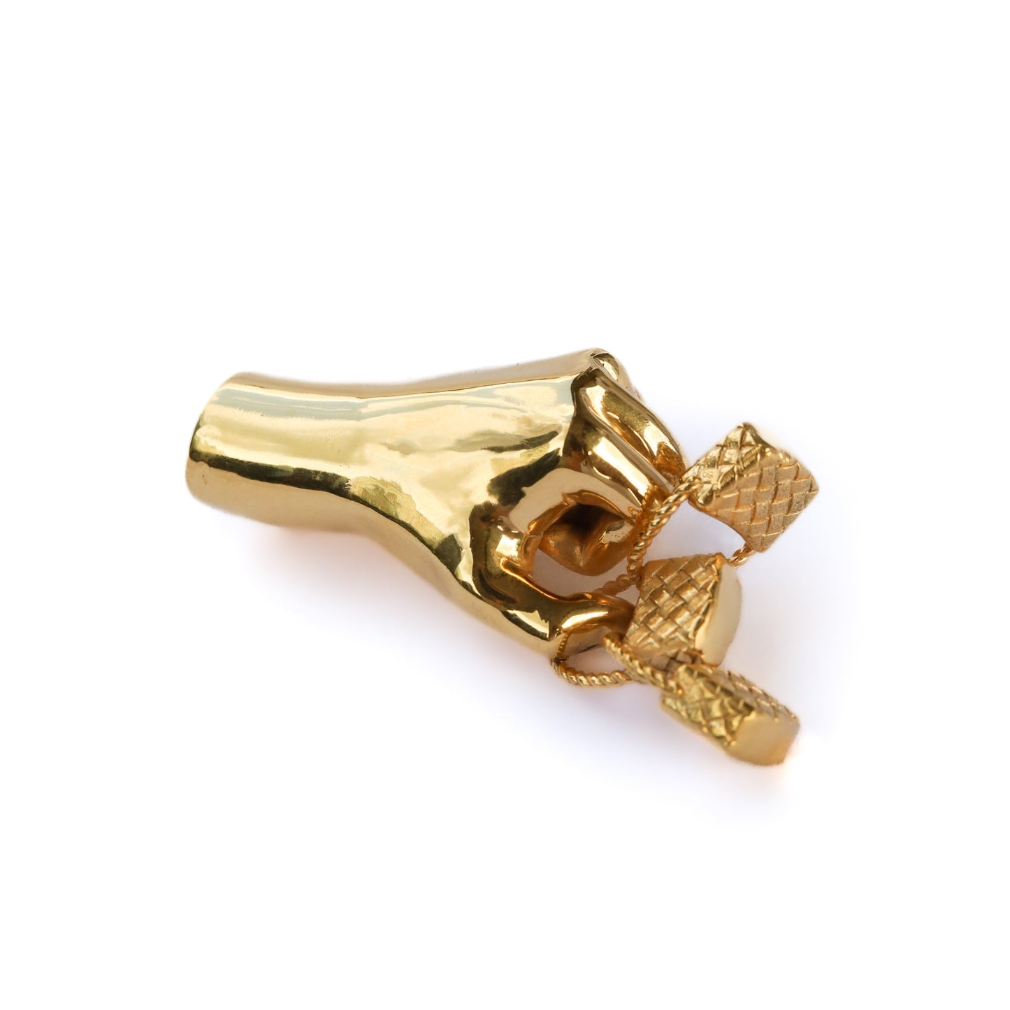 Gold-colored jewelry piece on a white background