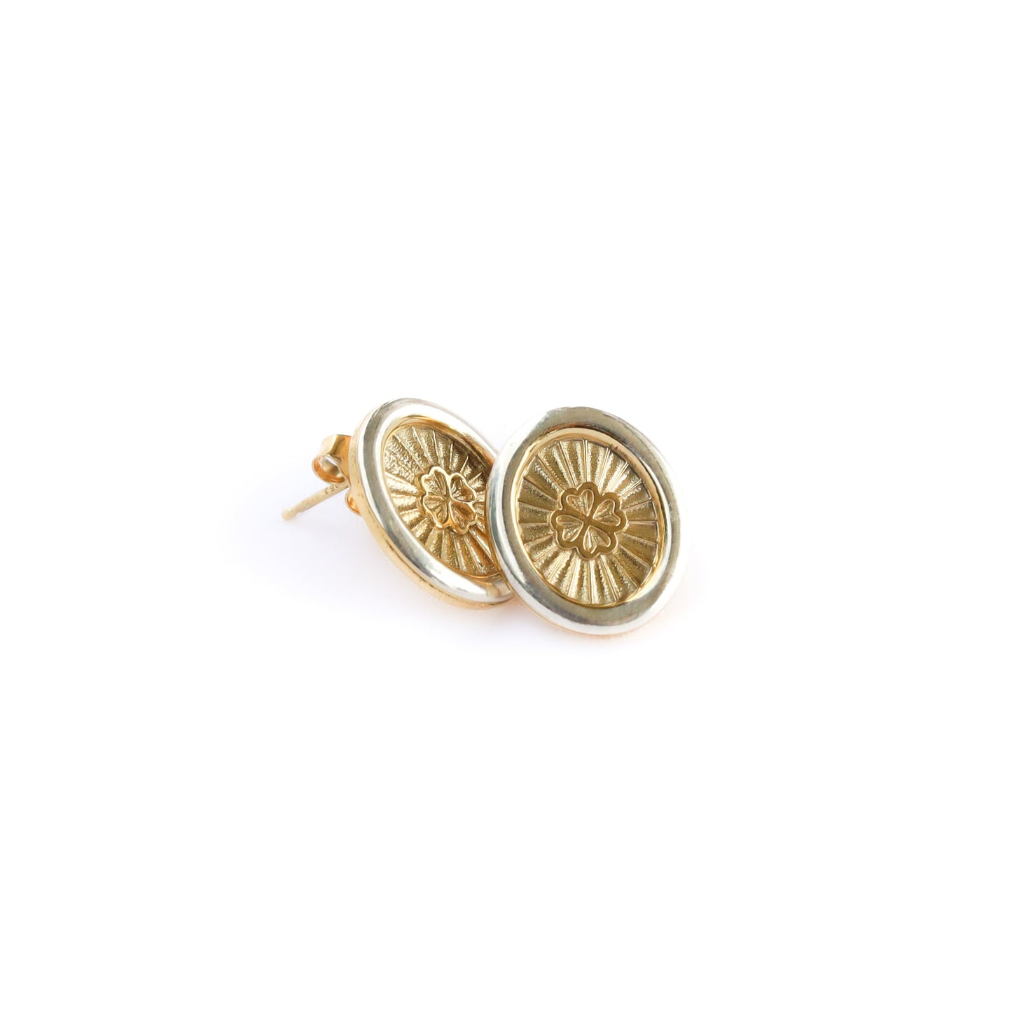 Gold earrings on a white background