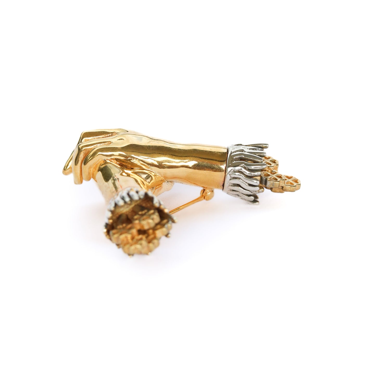 Gold and silver decorative item on a white background