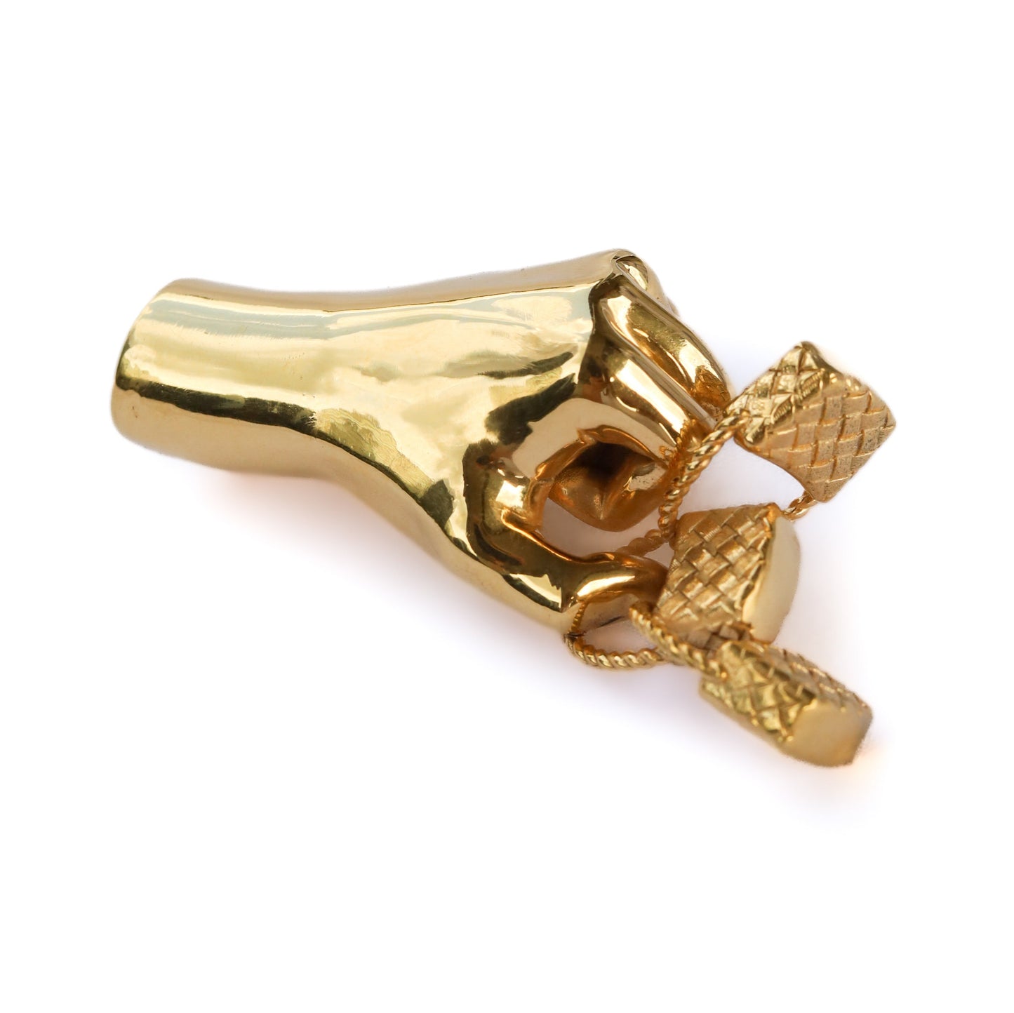 Jenna London gold-colored fist holding three baskets on a white background