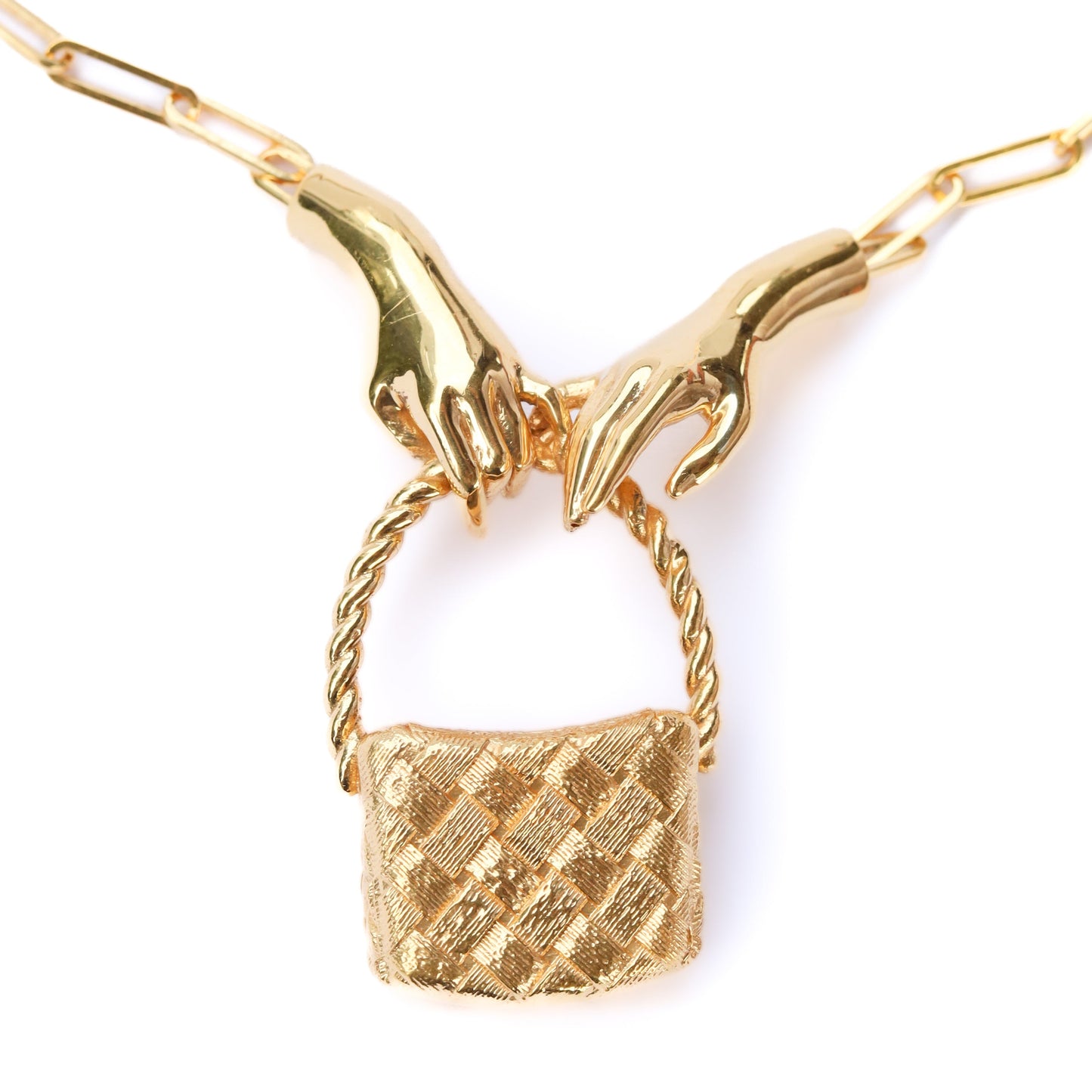 Gold necklace with a textured pendant on a white background