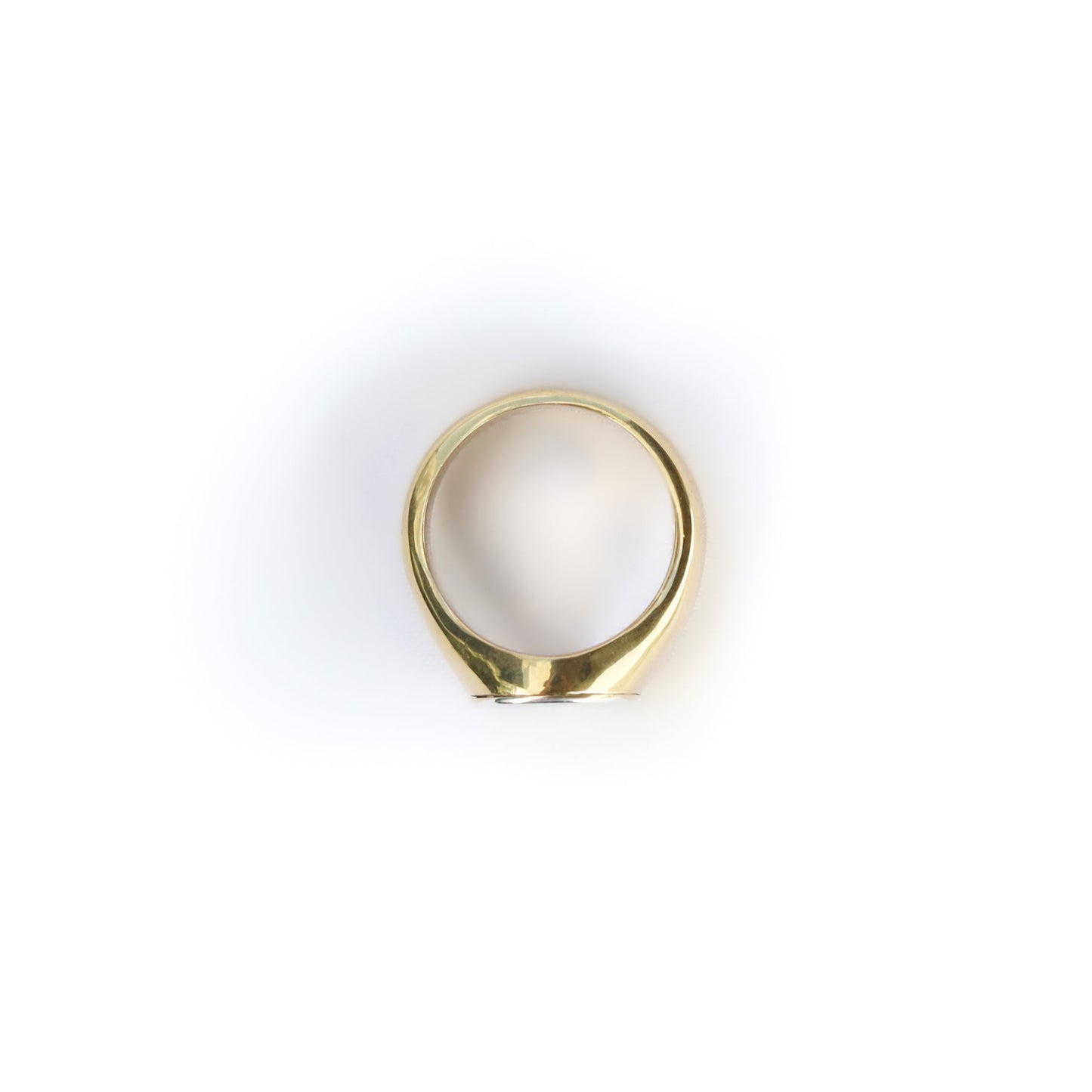 Gold ring on a white background