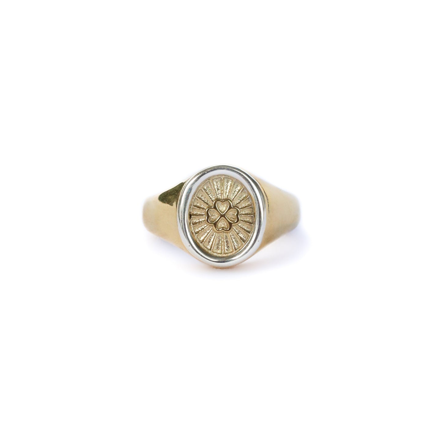 Gold ring with a circular design on a white background