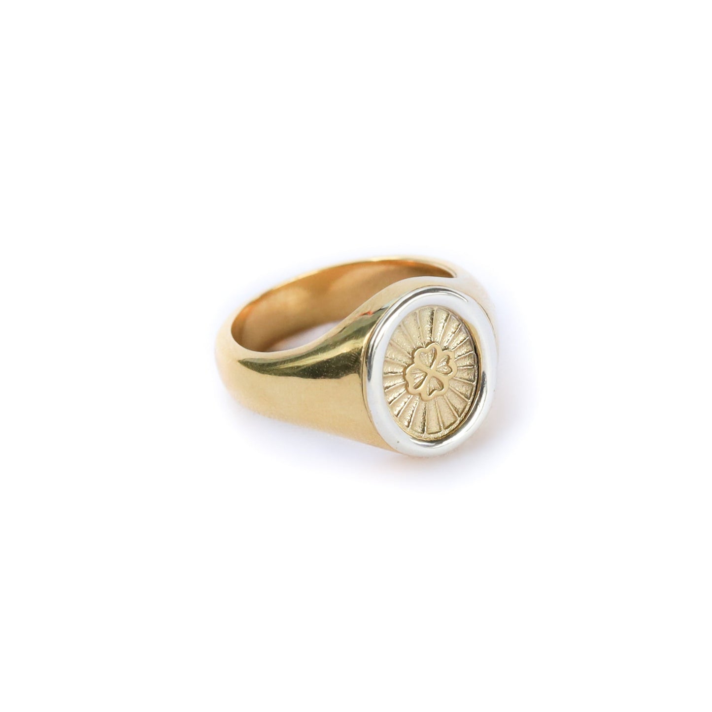 Gold ring with a circular design on a white background