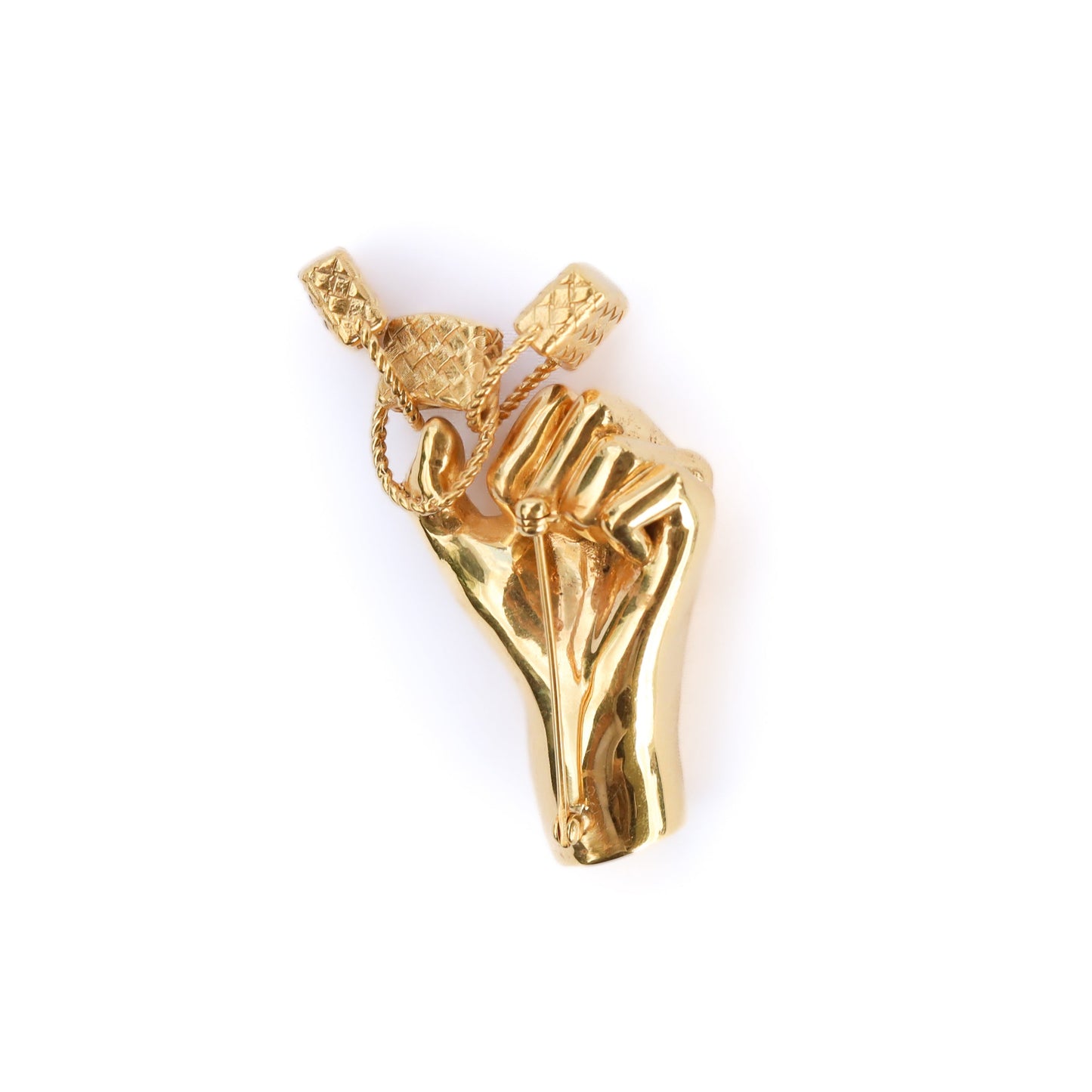 Gold pendant shaped like a hand holding a heart on a white background