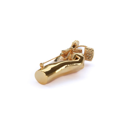 Gold shoe-shaped earring on a white background