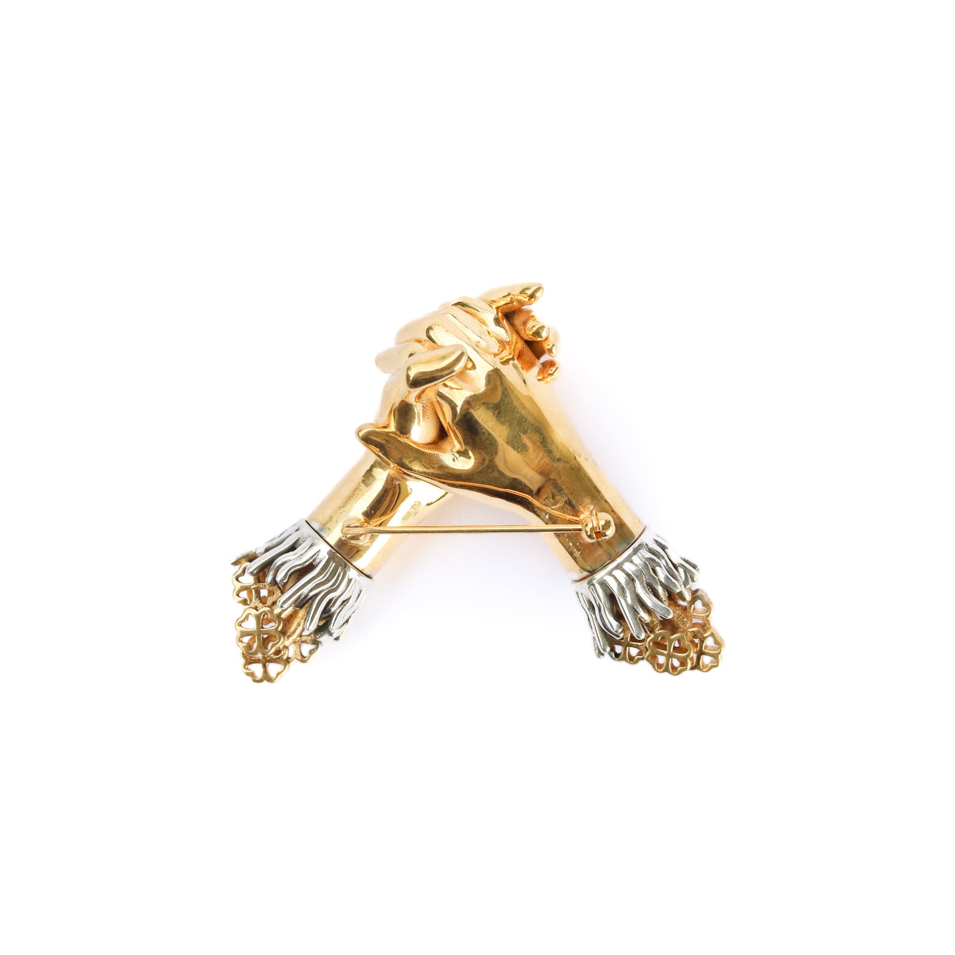 Jenna London Gold and silver lion head brooch on a white background