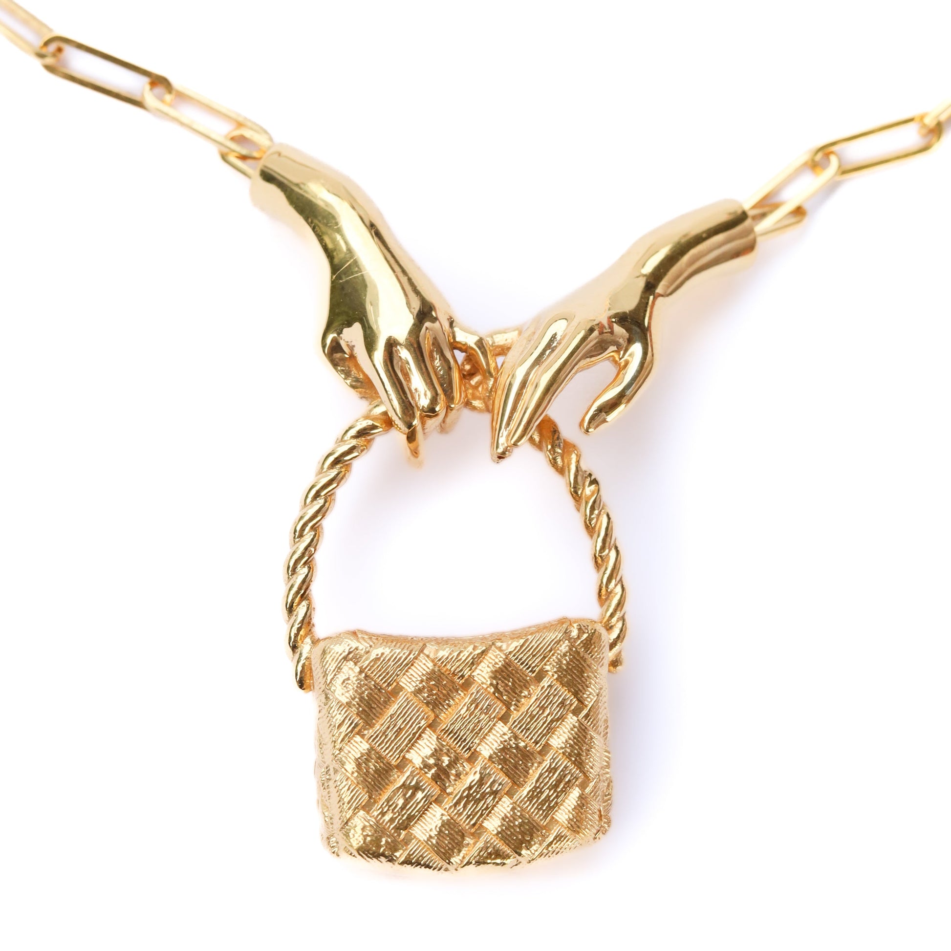 Gold necklace with a textured pendant on a white background