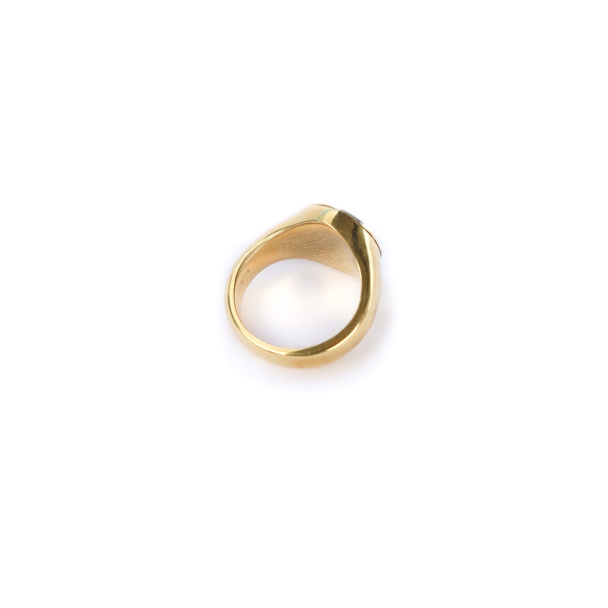 Gold ring on a white background